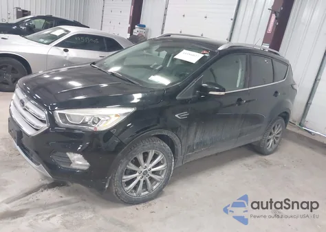 2017 Ford Escape Titanium z USA, uszkodzony, nr VIN 1FMCU9JD4HUE32081